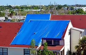 Blue plastic tarpaulin temporarily cover