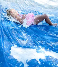 Young Girl Splashing Water and Bubbles S